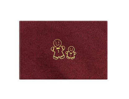 Detajl zlatih božičnih motivov na žametni naslovnici spominske škatle